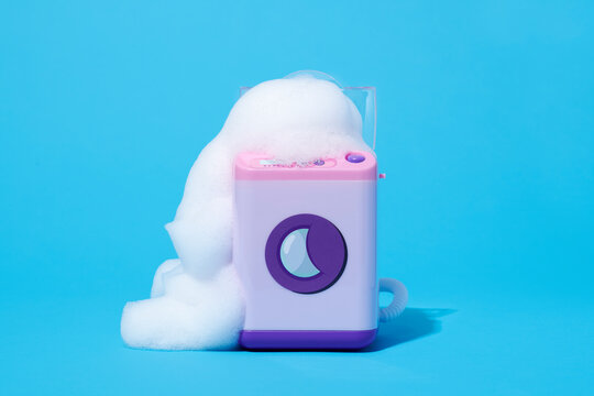 soap foam emerging from a toy washer