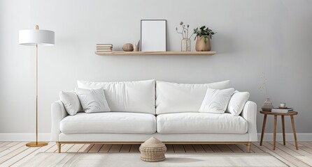 A white sofa and wooden shelf against a light gray wall in a living room with a floor lamp
