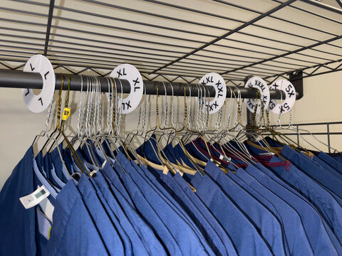 Uniforms coathanger  size on Coat Hangers in closet 