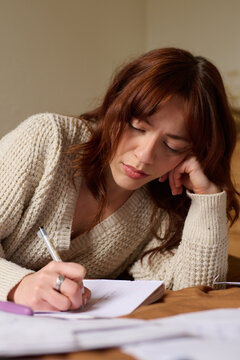 Woman Penning Down Thoughts