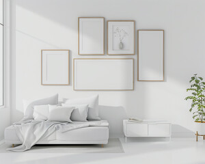 Stylish room design with four frames on a bright white wall, a white futon bed, and a white minimalist nightstand.