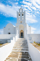 Stone steps to Chrysopigi monastery and beautiful white church, Sifnos island, Greece