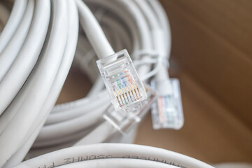 patch cords with RJ45 on the background of a blurred cardboard box