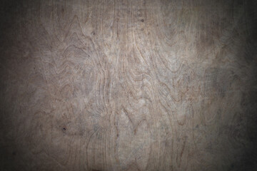 background with a vignette of cracked and weathered grey plywood texture.