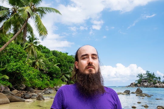 Portrait of a bearded male on the beach