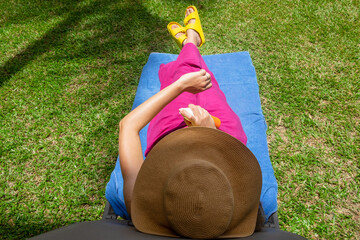 Females putting SPF cream on the skin 