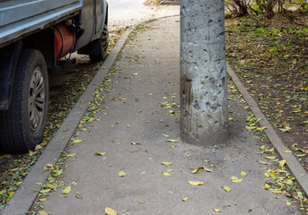 Concrete pillar installed in the middle of the pedestrian sidewalk