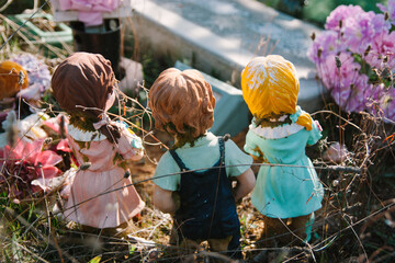 Figurines and Flowers left on a Child's Grave