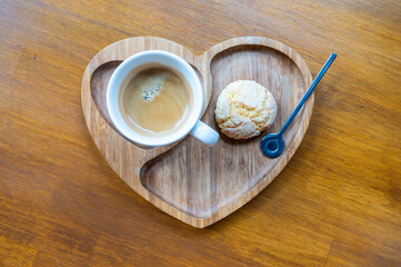 Overhead shot of a cup of coffee and a home made cookie, Belgium