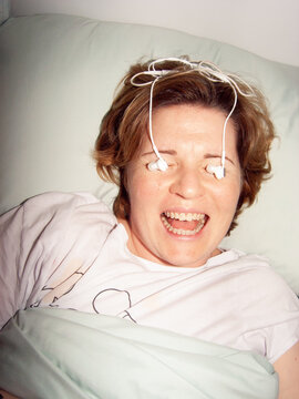 Laughing girl in bed