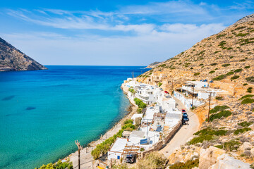 View of Kamares port sea bay and village in mountain landscape, Sifnos island, Greece