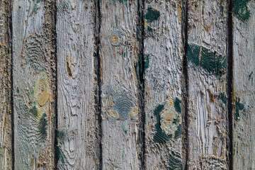 Weathered wooden planks with peeling paint