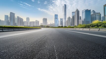 curved asphalt highway road and city skyline early morning light.