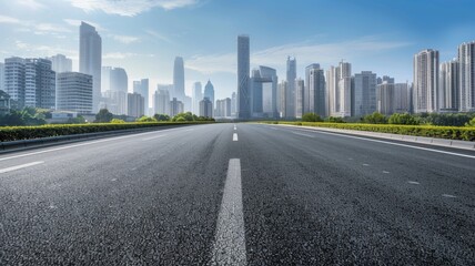 curved asphalt highway road and city skyline early morning light.