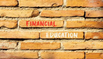 Financial education symbol. Concept words Financial education on beautiful brick wall. Beautiful red brown brick wall background. Business Financial education concept. Copy space.