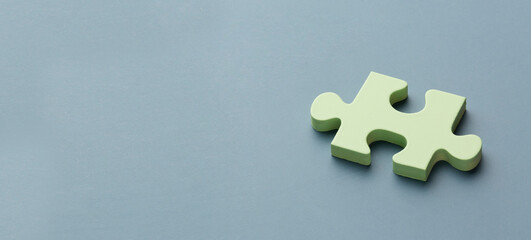 Puzzle piece with copy space on blue background