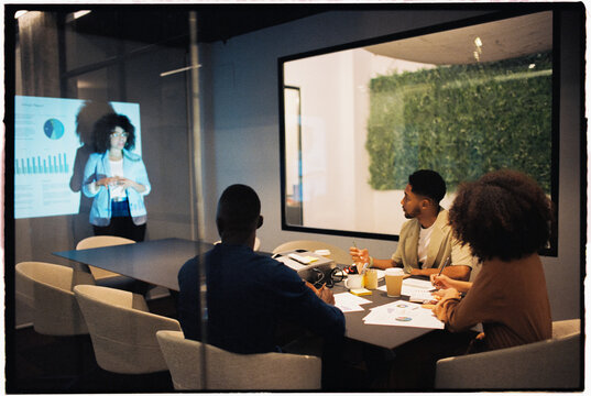 Woman presenting financial report to the board