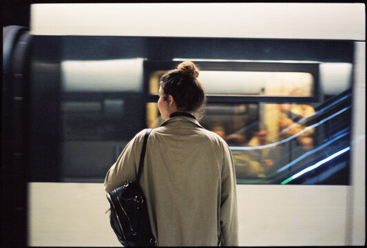 Woman waiting for arriving train at station