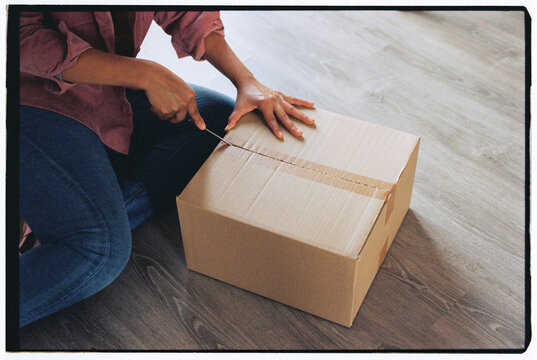 Woman unpacking box