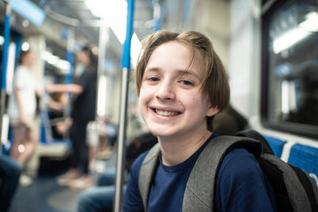 11 year old boy sitting in the subway