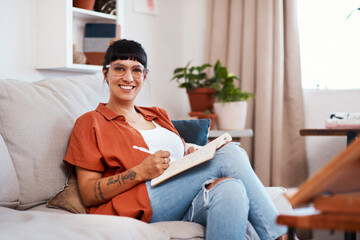 Woman, portrait and creative with paper on sofa for sketch, artistic vision for card company....