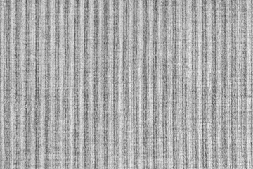 Ridge texture background of velour corduroy gray cloth. Large ribbed, coarse weaving velveteen,...