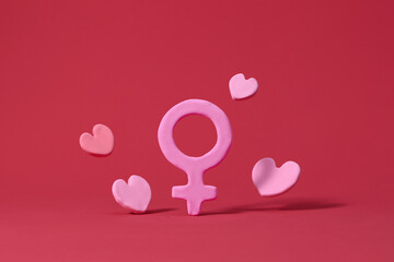 International Women's Day theme with hearts and female icon 