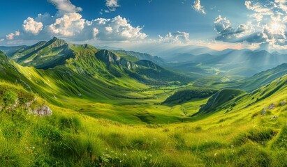 Obraz premium Beautiful summer landscape with green grass, mountains and blue sky with sun rays