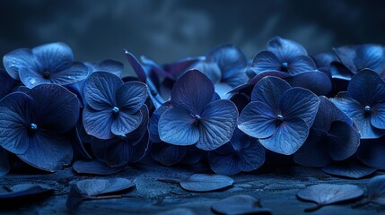   A cluster of blue blooms resting atop a wooden table, surrounded by foliage