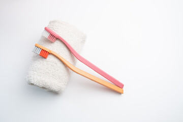 Colored toothbrushes on a color background. Replace your old toothbrush with a new one. Old and new toothbrushes. Dental health and hygiene concept