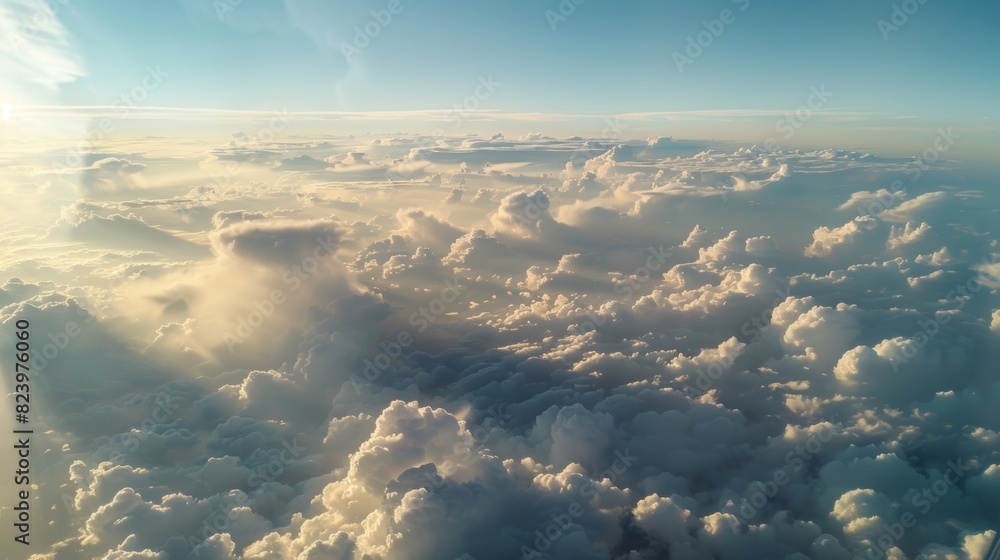 Poster the view from a plane window with pyrocumulus clouds stretching out as far as the eye can see.