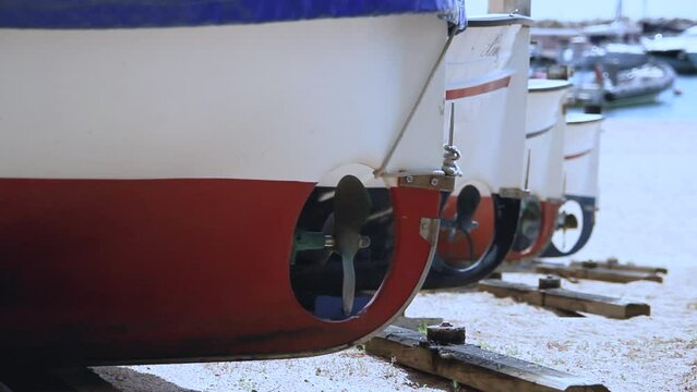 Detail of the propellers that propel the traditional wooden fishing boats in the bay of Llafranc. Costa Brava, Catalonia, Spain