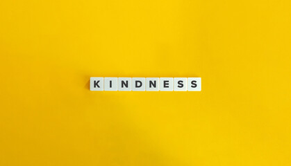 Kindness Word. Text on Block Letter Tiles on Flat Background. Minimalist Aesthetics.