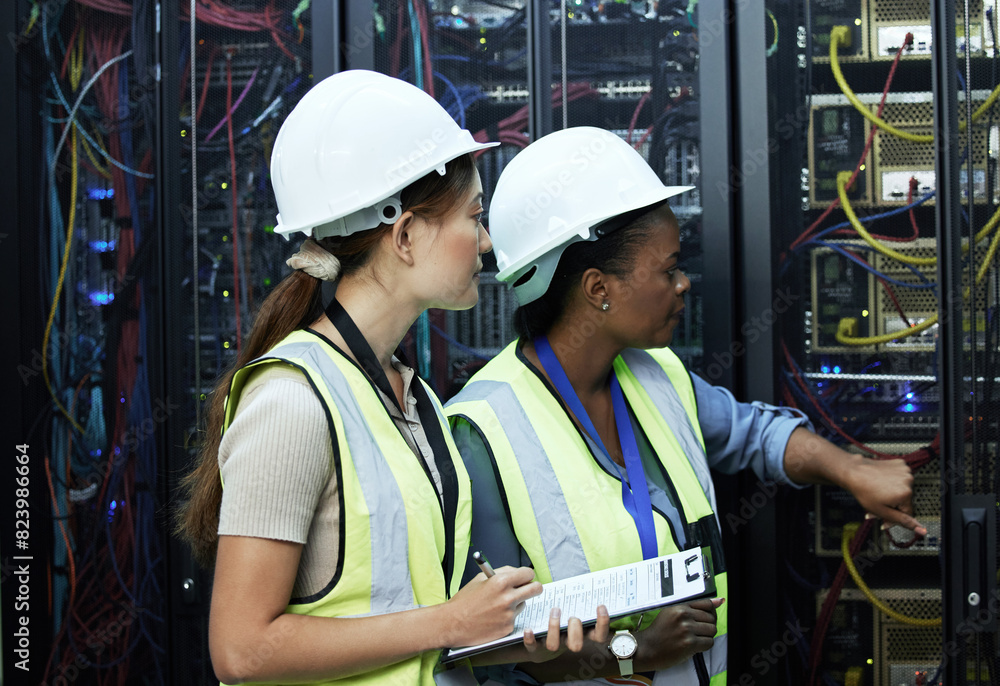 Fototapete Inspection, women and computer engineer with pointing in data center for teamwork or collaboration. Female people, clipboard and tech hardware security in server room for system update or maintenance
