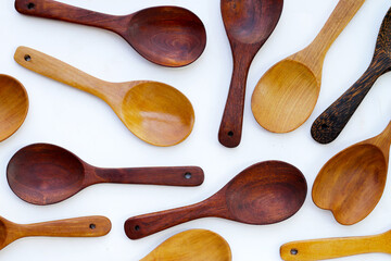 Wooden spoon on white background.