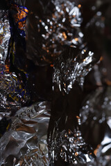 Abstract texture. Aluminium foil. Glittering crumpled foil