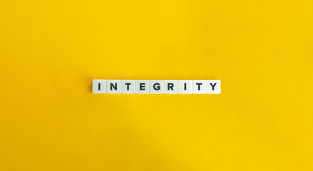 Integrity Word. Concept of Upholding strong moral principles and being consistent in actions and values. Text on Block Letter Tiles on Yellow Background. Minimalist Aesthetics.