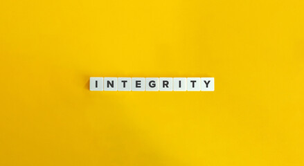 Integrity Word. Concept of Upholding strong moral principles and being consistent in actions and values. Text on Block Letter Tiles on Yellow Background. Minimalist Aesthetics.