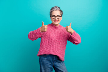 Photo of good mood person with gray hair dressed knit sweater in eyewear showing thumbs up nice job...