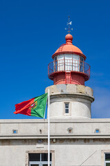 Portugese flag and Albarnaz Lighthouse on Flores Island.