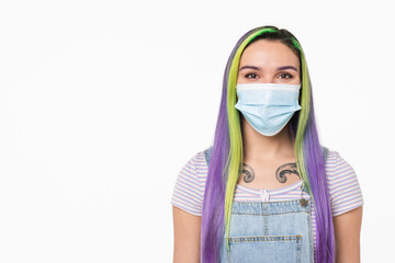 Pandemic concept. Caucasian young teenage hipster girl wearing protective face mask against...