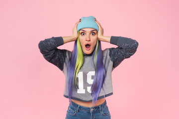 Excited happy cheerful young caucasian woman teenage girl hipster with dyed colorful hair looking...
