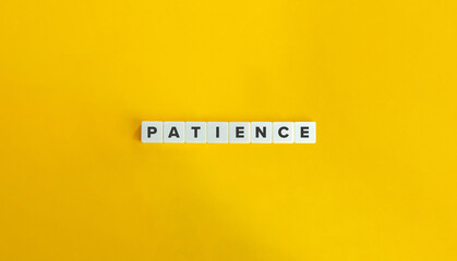 Patience Word. Concept of Exhibiting tolerance and understanding in difficult situations. Text on Block Letter Tiles on Flat Background. Minimalist Aesthetics.