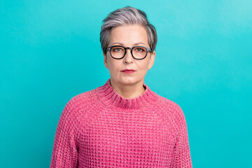 Photo of serious strict woman with white gray hairstyle dressed pink knit sweater in glasses...