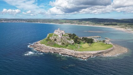 St Michael's Mount is a tidal island in Mount's Bay, Cornwall, England, United Kingdom. The island is a civil parish and is linked to the town of Marazion by a causeway of granite setts, passable bet