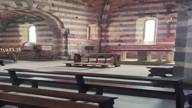 Sunlit Abandoned Stone Church: Rustic Echoes