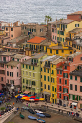 View of the colorful town of Vernazza under a cloudy sky, Cinque Terre, Liguria,  Italy