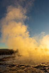 Fototapeta premium Stokkur geyser spectacular eruption in front of the sun , Iceland
