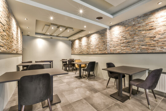 Modern cafe interior with stone walls at Blassiusstraat 5-1