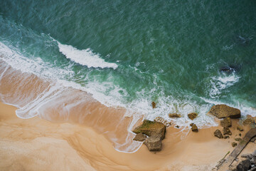 The picturesque Nazaré beach on the shores of the Atlantic Ocean. View from above on a spring day.